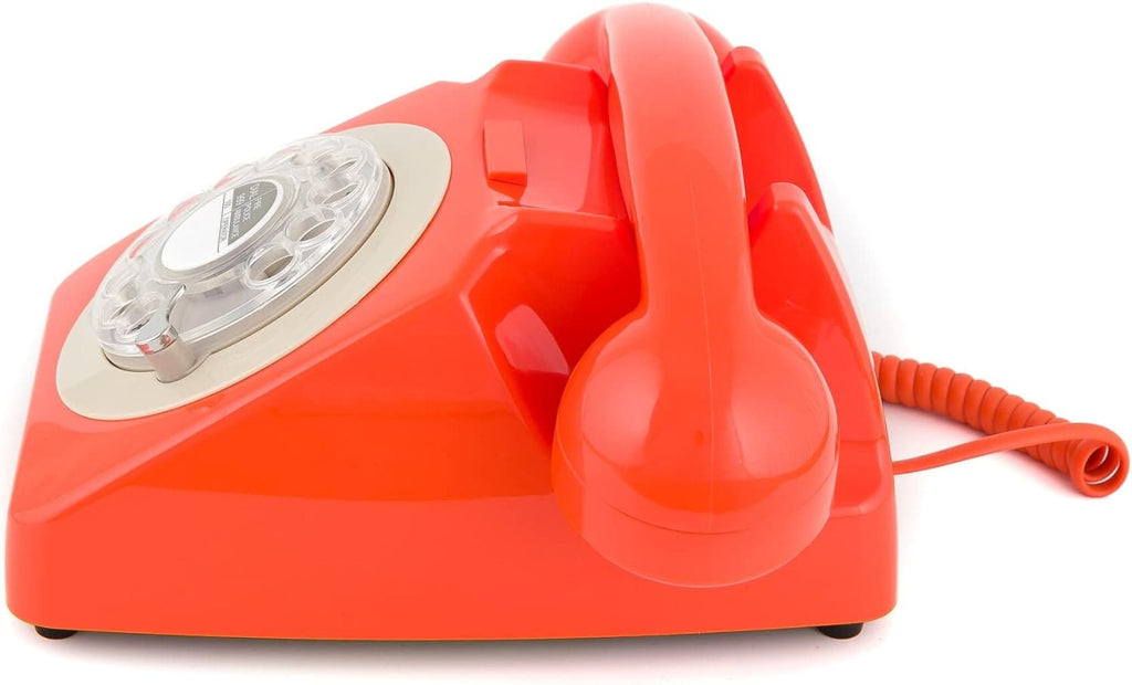 Téléphone fixe rotatif de la marque GPO, des années 60 et 70, en plastique. Coloris Orange.