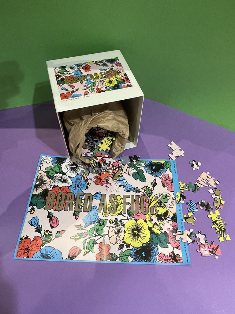 Puzzle bored as fuck de 1000 pièces de la marque Piece & Love, aux couleurs chaudes, fabriqué en France avec des cartons FSC.